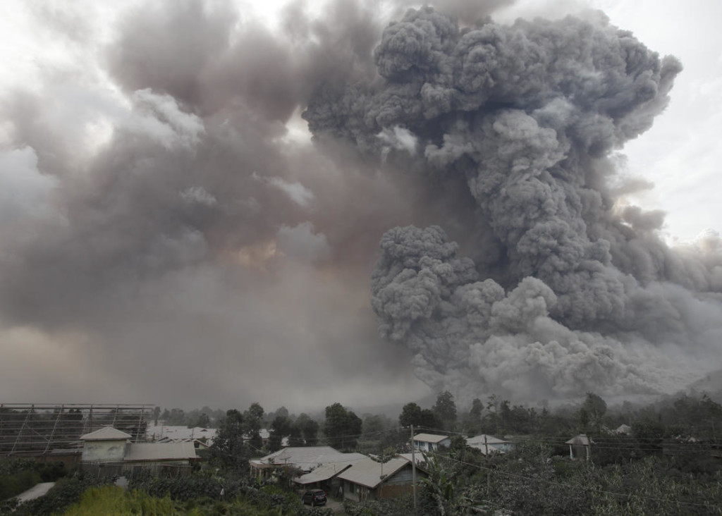  Fourteen people, including four schoolchildren, were killed on Saturday after they were engulfed in scorching ash clouds spat out by Mount Sinabung. Photo: Y. T. Haryono/Reuters/The Jakarta Globe