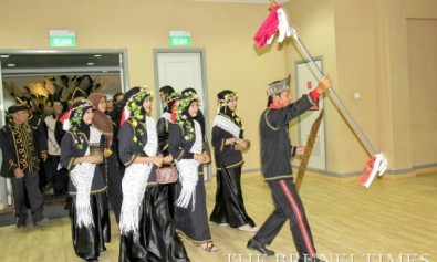 Juin Antin (1st R) leads members of the Dusun community in a traditional dance at the Adau Gayoh event. Photo: Daniel Wood/The Brunei Times